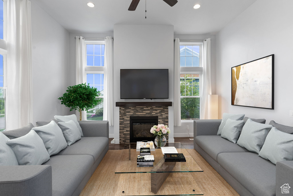 Living room featuring ceiling fan and hardwood / wood-style floors