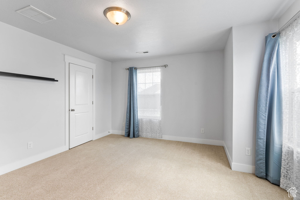 View of carpeted spare room