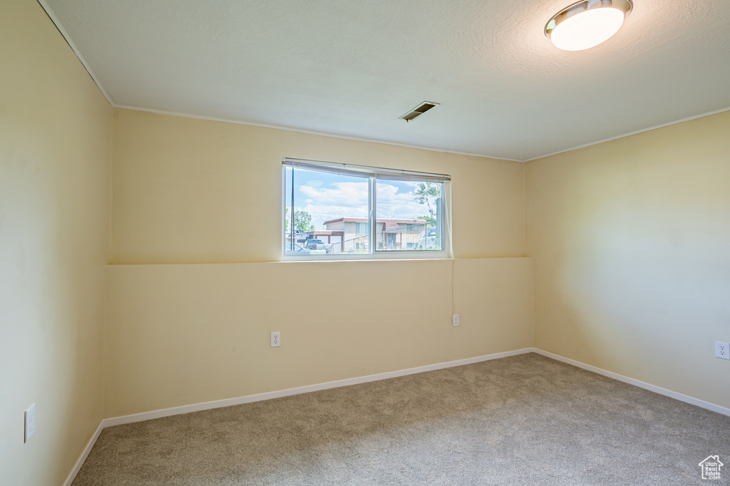 Unfurnished room with carpet floors