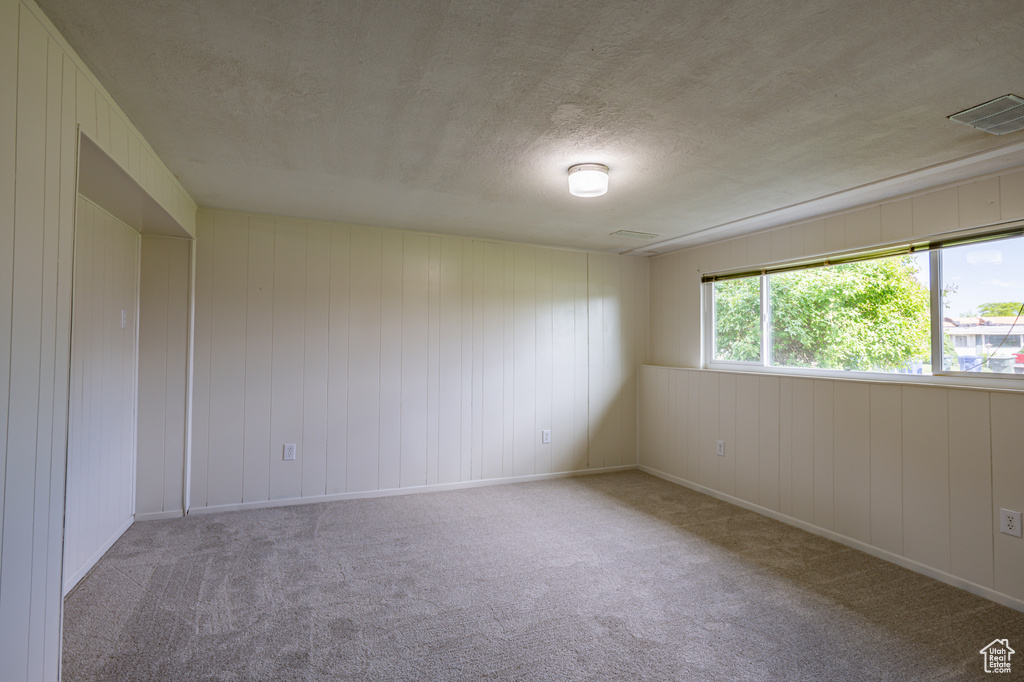 Spare room with carpet floors