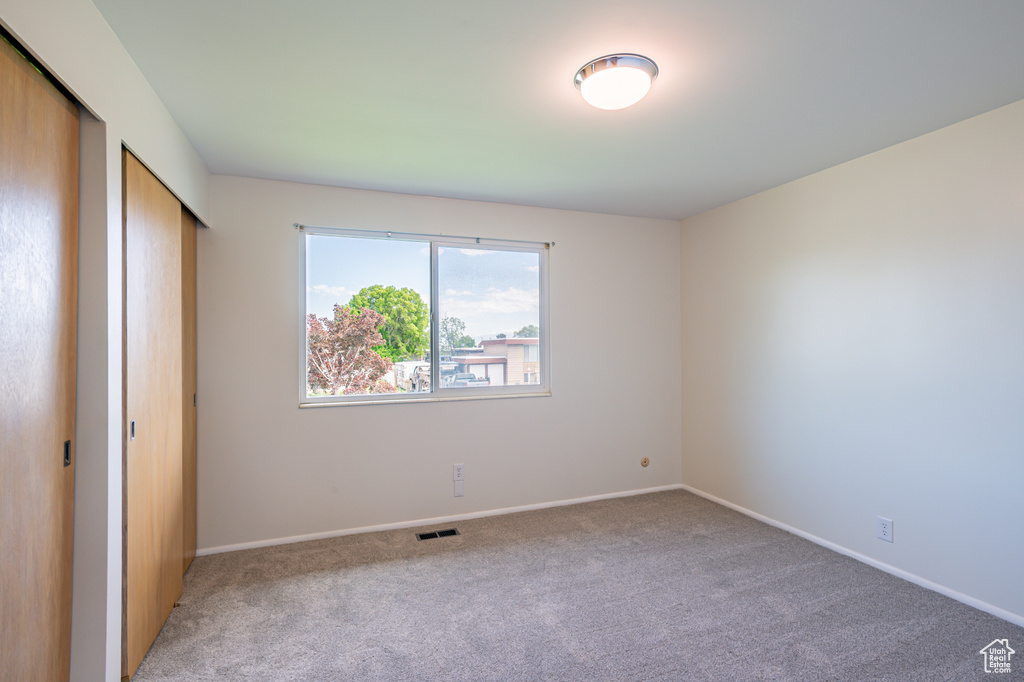 Unfurnished bedroom featuring carpet