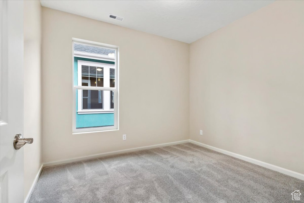 Empty room featuring carpet flooring