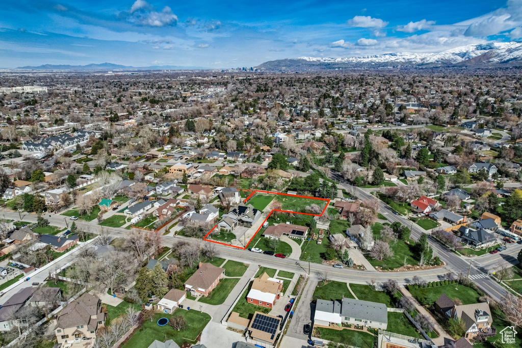 Birds eye view of property with a mountain view