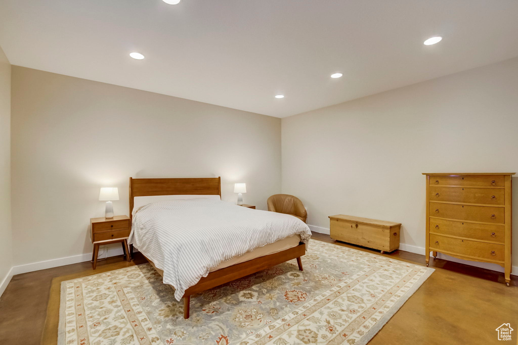 Bedroom with concrete flooring