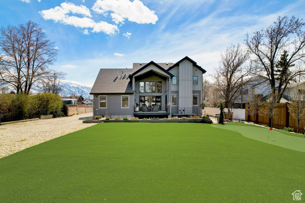 Back of house featuring a mountain view