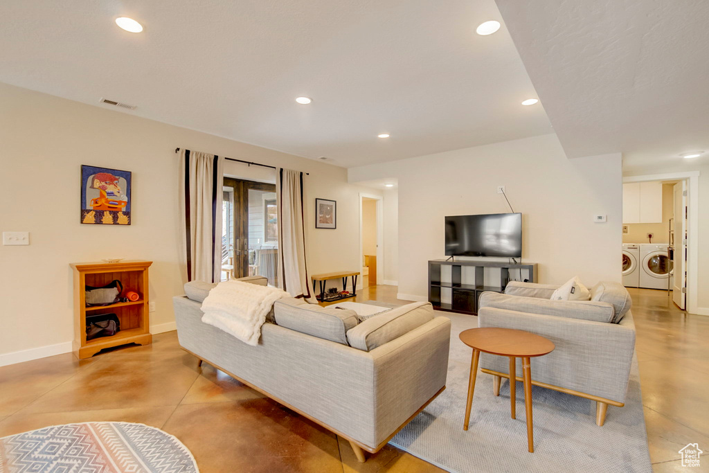 Living room with washing machine and dryer