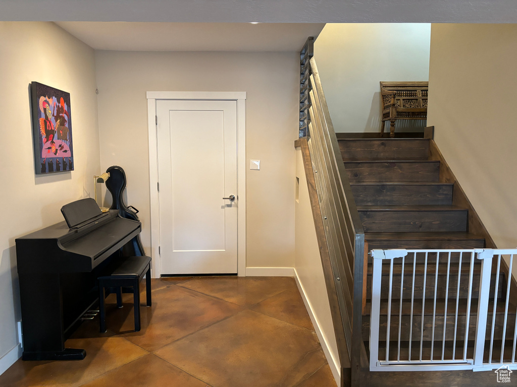 Stairs featuring tile flooring