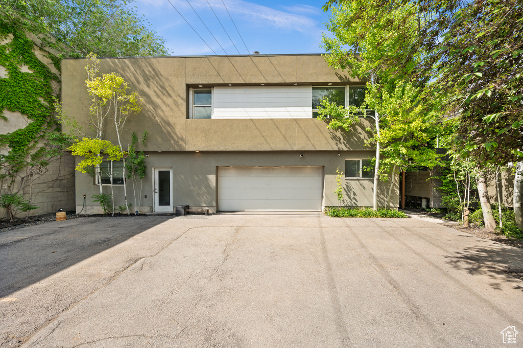 Townhome / multi-family property featuring a garage