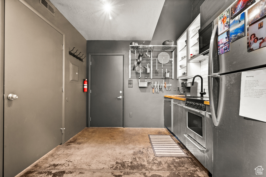 Kitchen featuring sink and appliances with stainless steel finishes