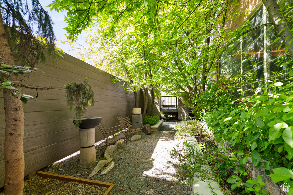 View of yard with a wooden deck