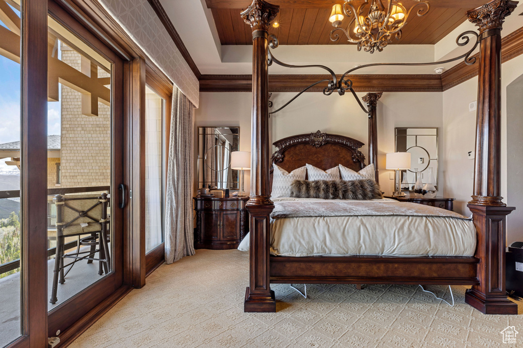 Carpeted bedroom featuring wooden ceiling, a raised ceiling, and multiple windows