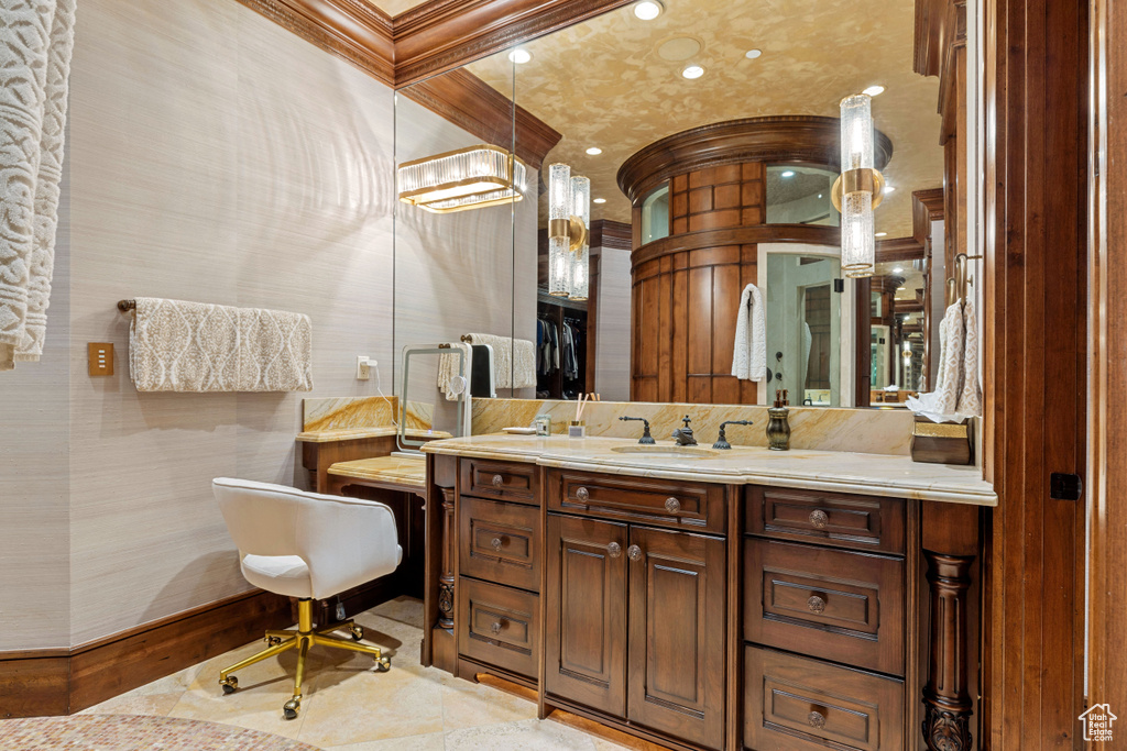 Bathroom featuring tile floors and vanity