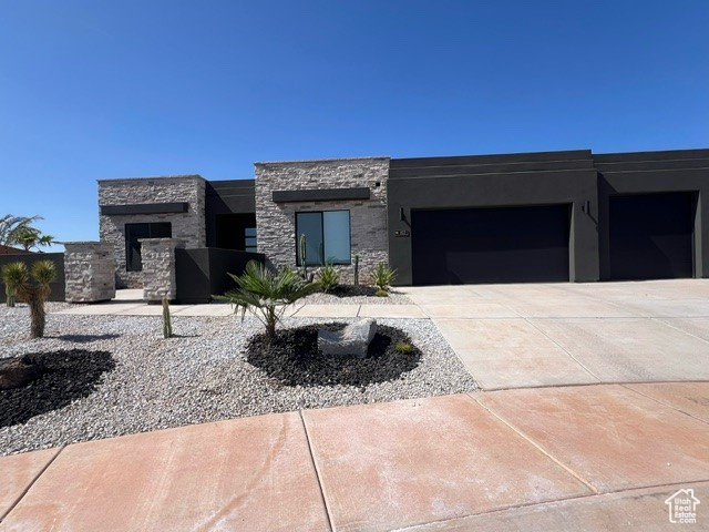 View of front of property featuring a garage