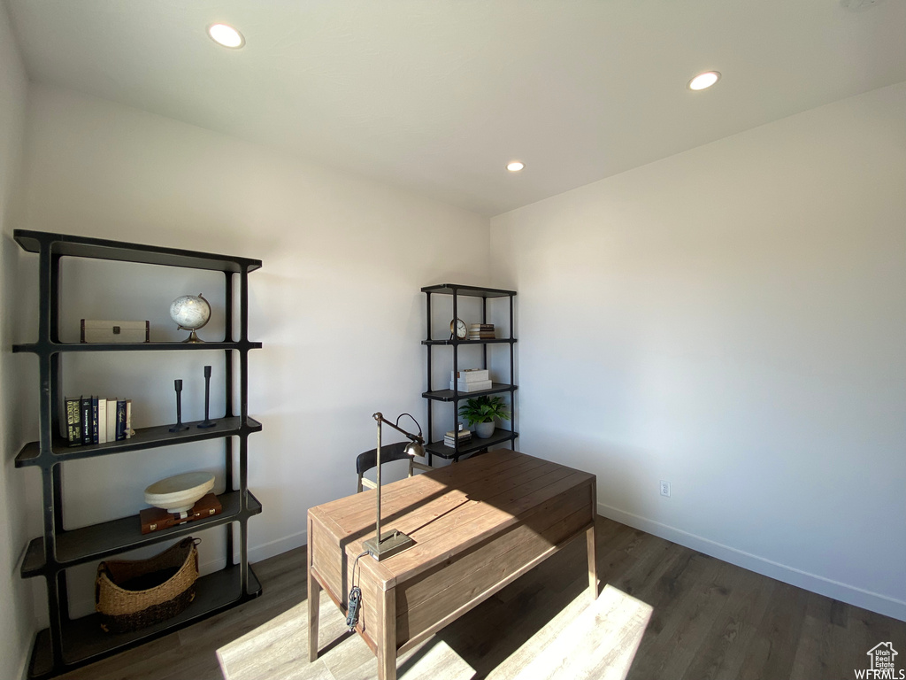 Office space featuring dark hardwood / wood-style flooring