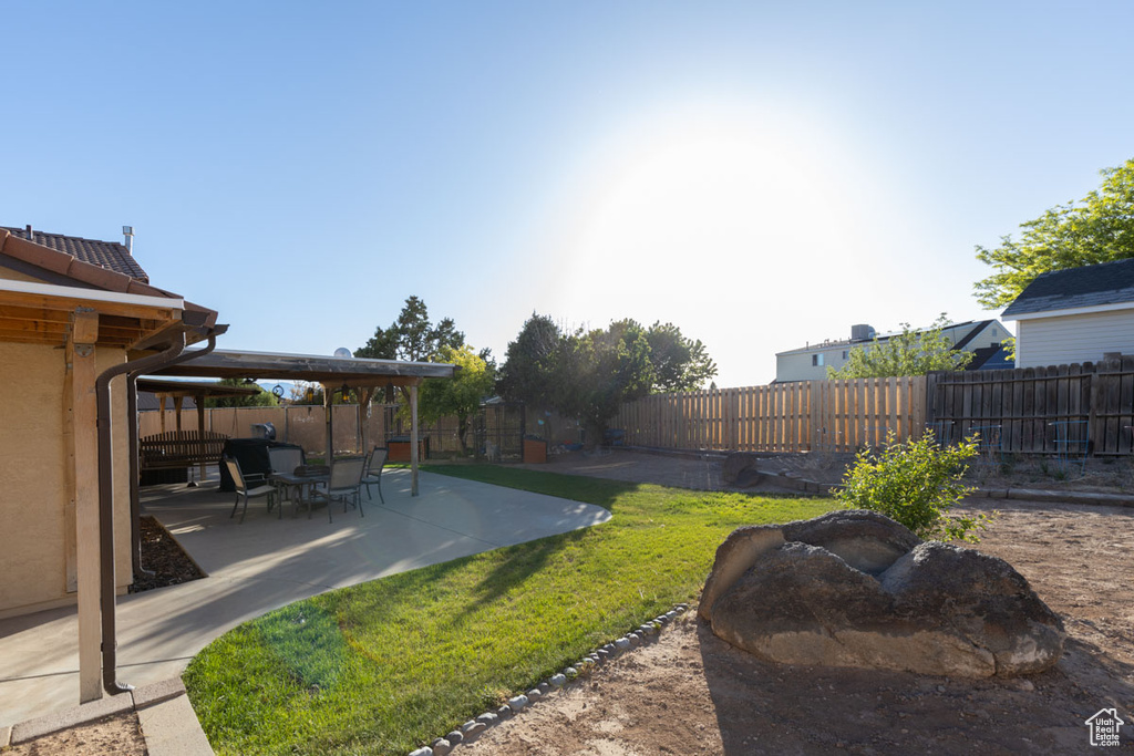 View of yard with a patio area