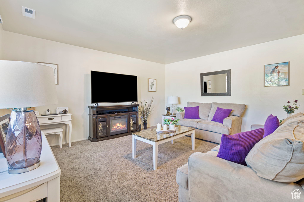 Living room featuring carpet floors