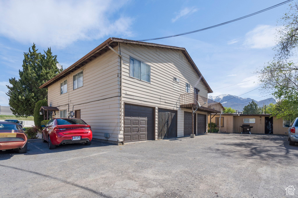 View of home\'s exterior featuring a garage and a mountain view