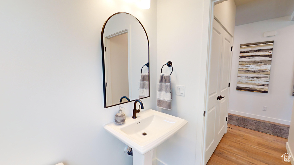 Bathroom featuring sink and hardwood / wood-style flooring