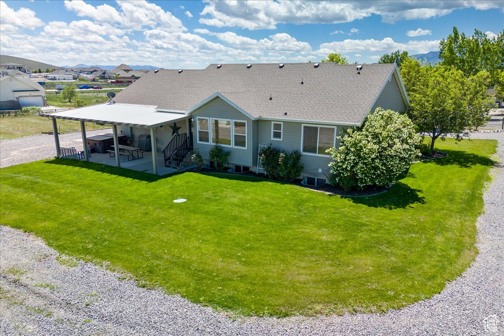 View of front of house with a front yard