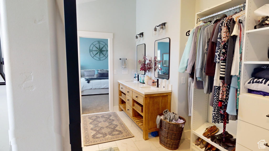 Bathroom featuring tile flooring and vanity