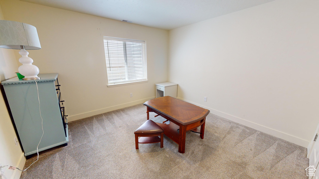 Sitting room featuring carpet floors