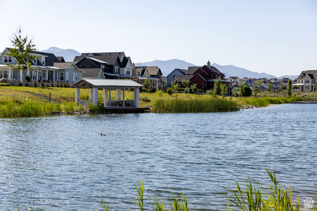 Property view of water with a mountain view and a gazebo