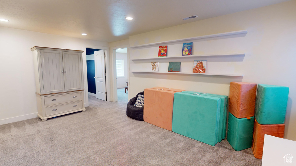 Interior space featuring light colored carpet