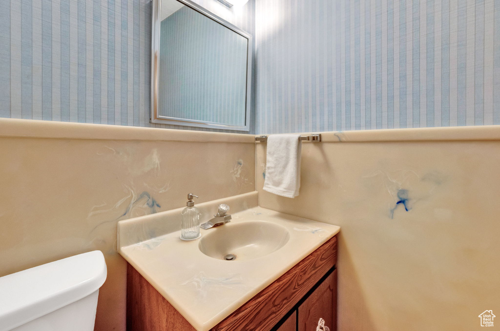 Bathroom featuring toilet and vanity