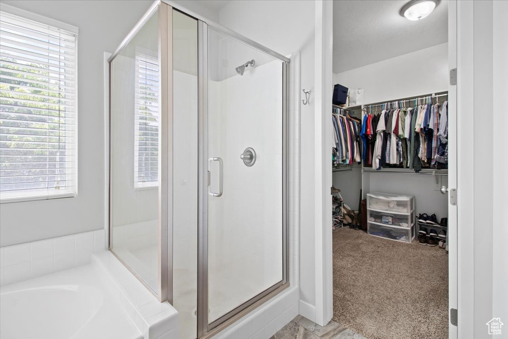 Bathroom featuring independent shower and bath