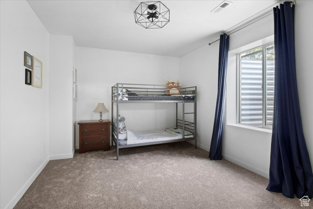 Unfurnished bedroom with carpet floors