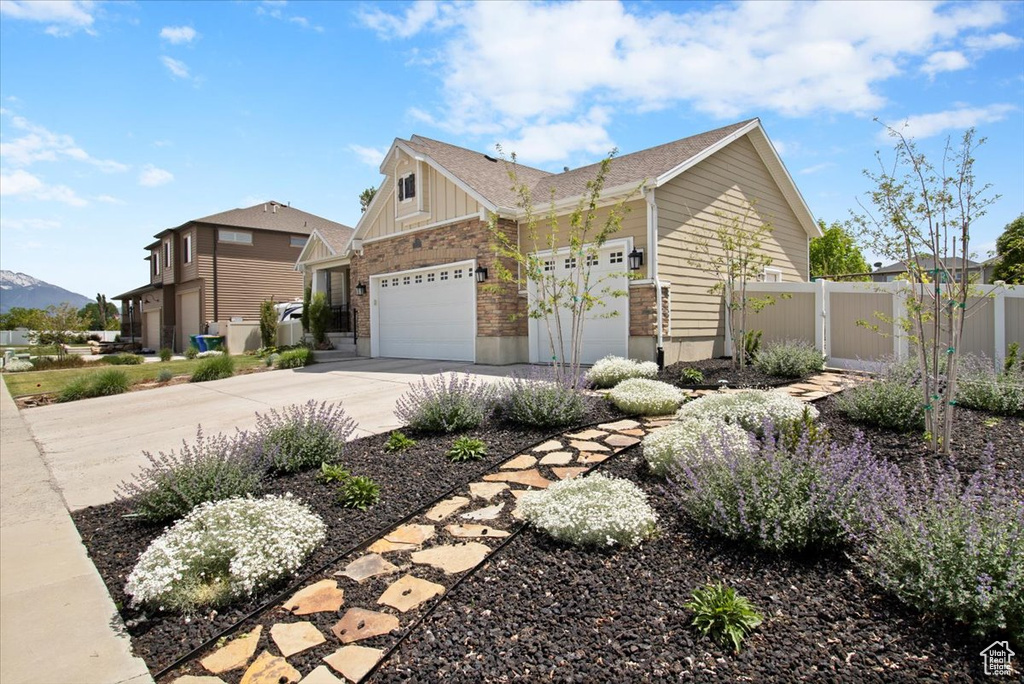 View of property exterior featuring a garage