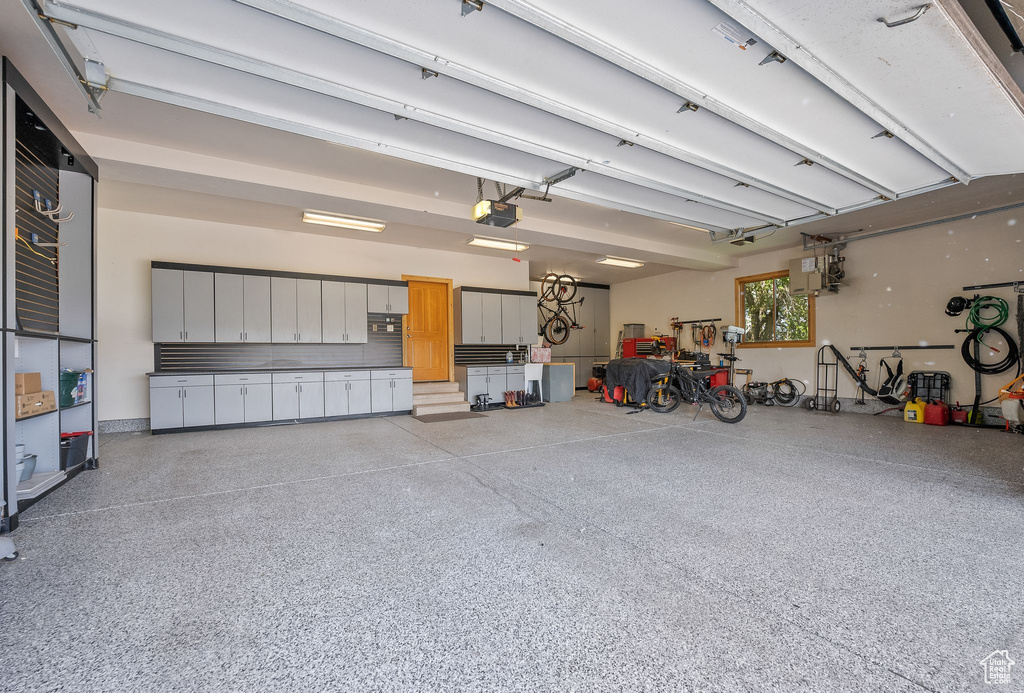 Garage featuring a garage door opener