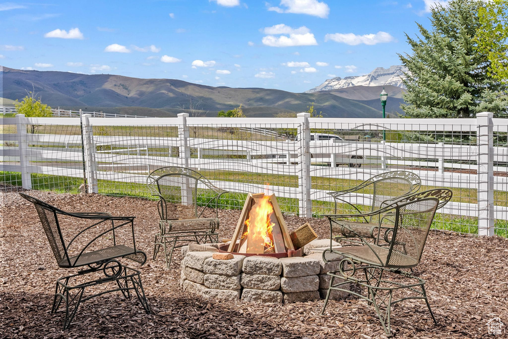 View of yard with a fire pit and a mountain view