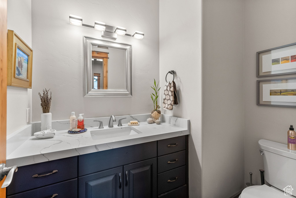 Bathroom featuring vanity and toilet