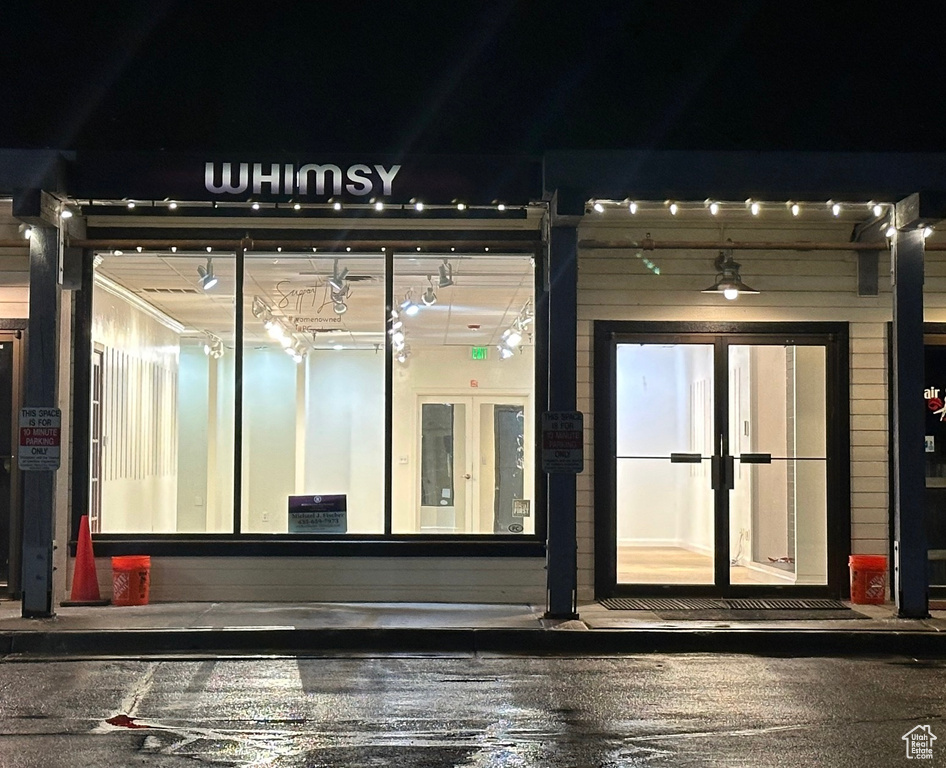 Exterior entry at twilight with french doors