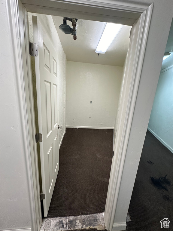 Hall with dark colored carpet