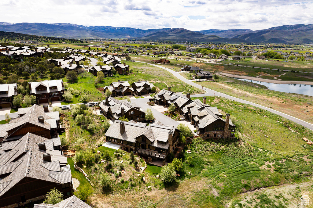 Aerial view featuring a water and mountain view