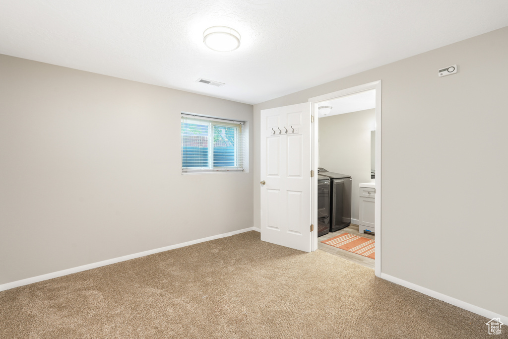 Unfurnished bedroom featuring carpet and connected bathroom