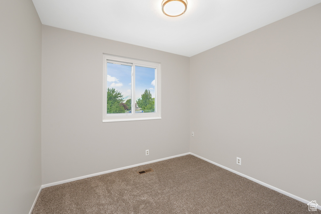 Empty room featuring carpet