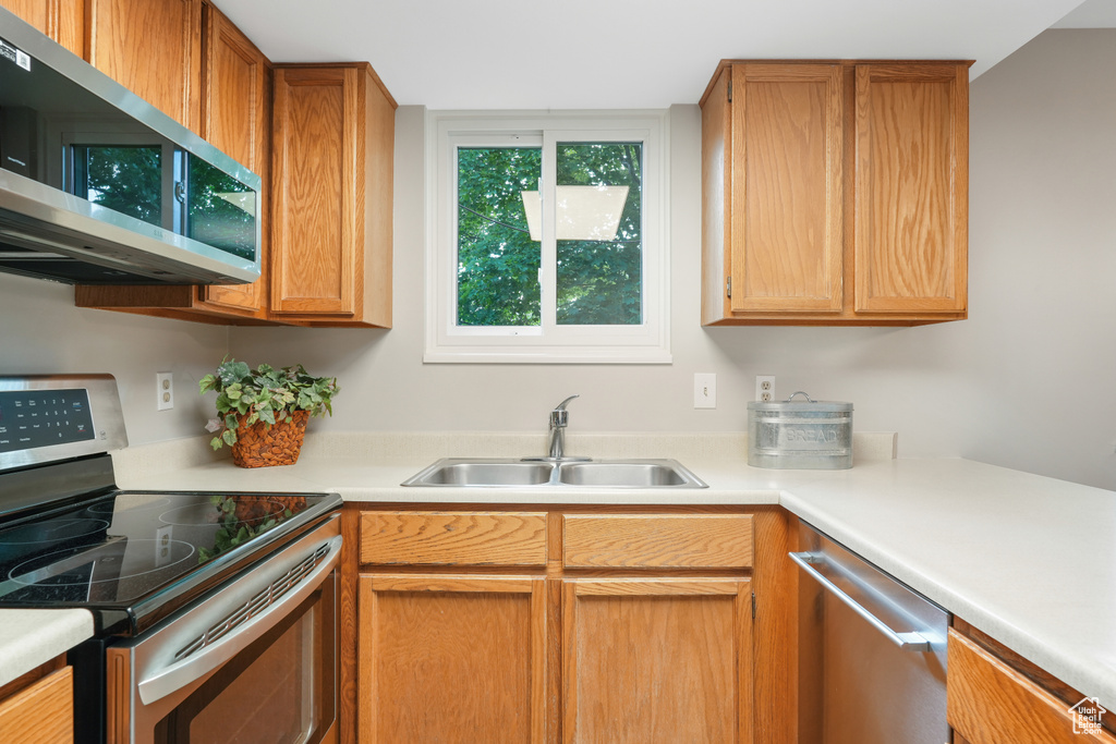 Kitchen with stainless steel appliances and sink