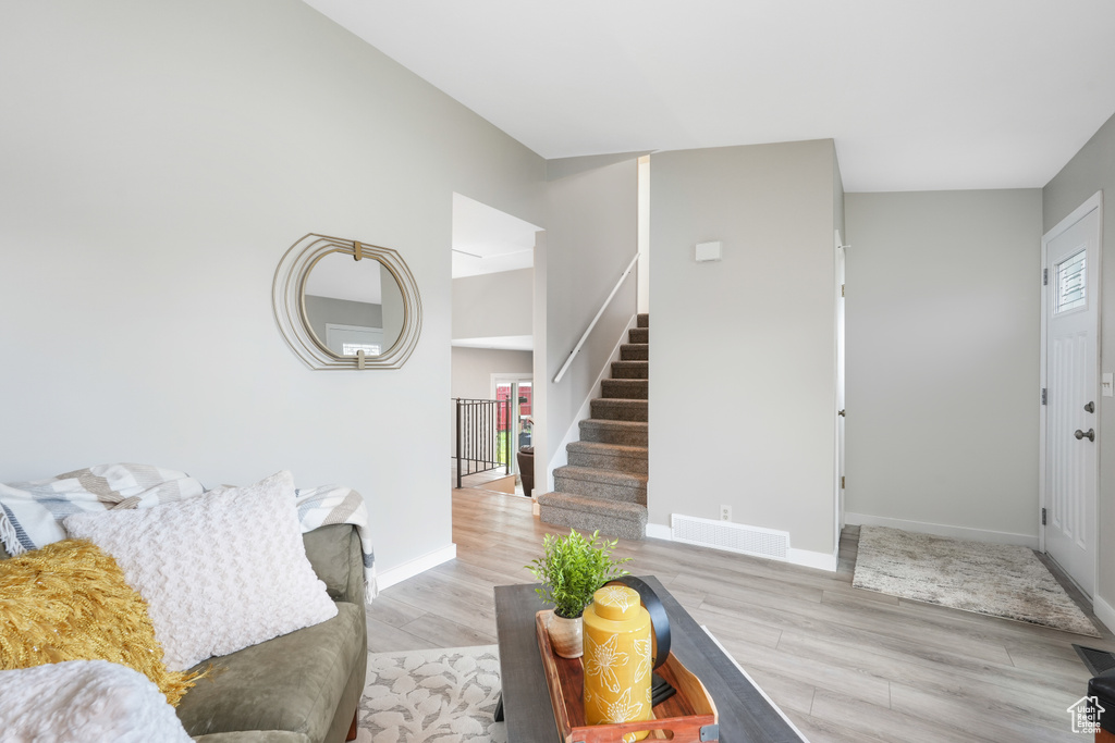 Living room with wood-type flooring