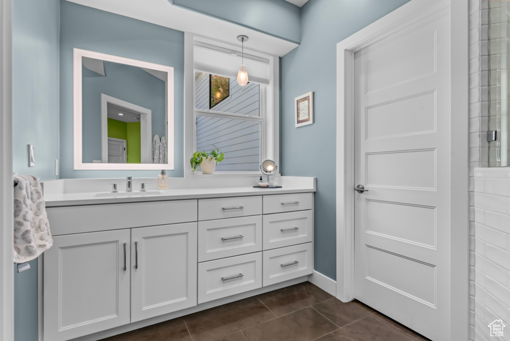 Bathroom with tile flooring and vanity