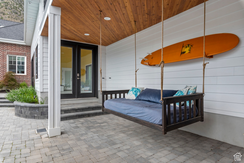 Exterior space with french doors and wood ceiling