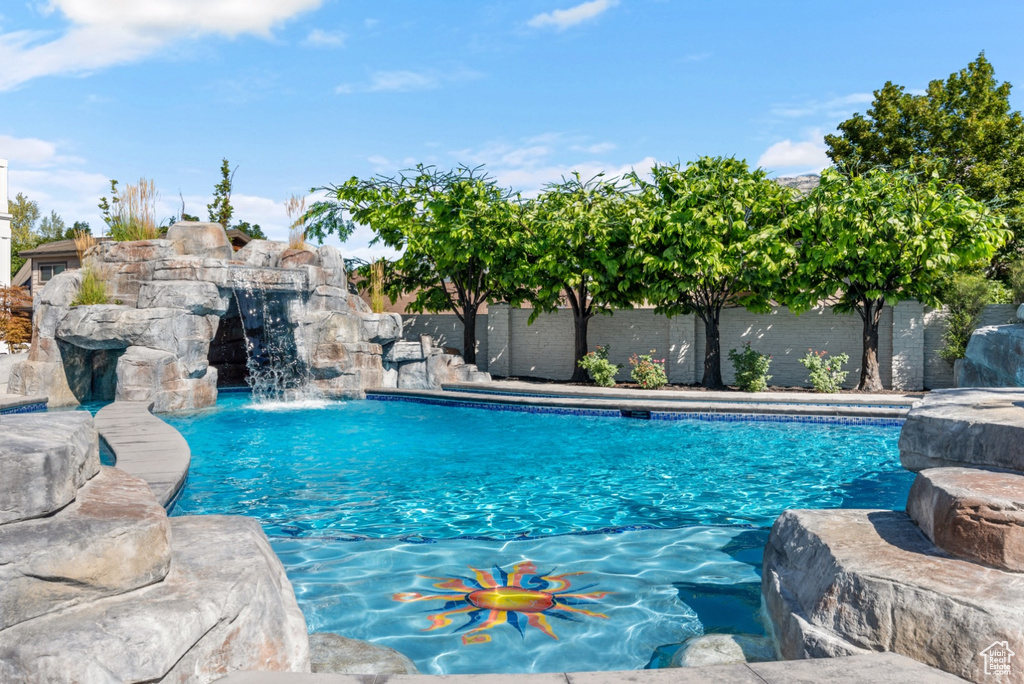 View of swimming pool featuring pool water feature