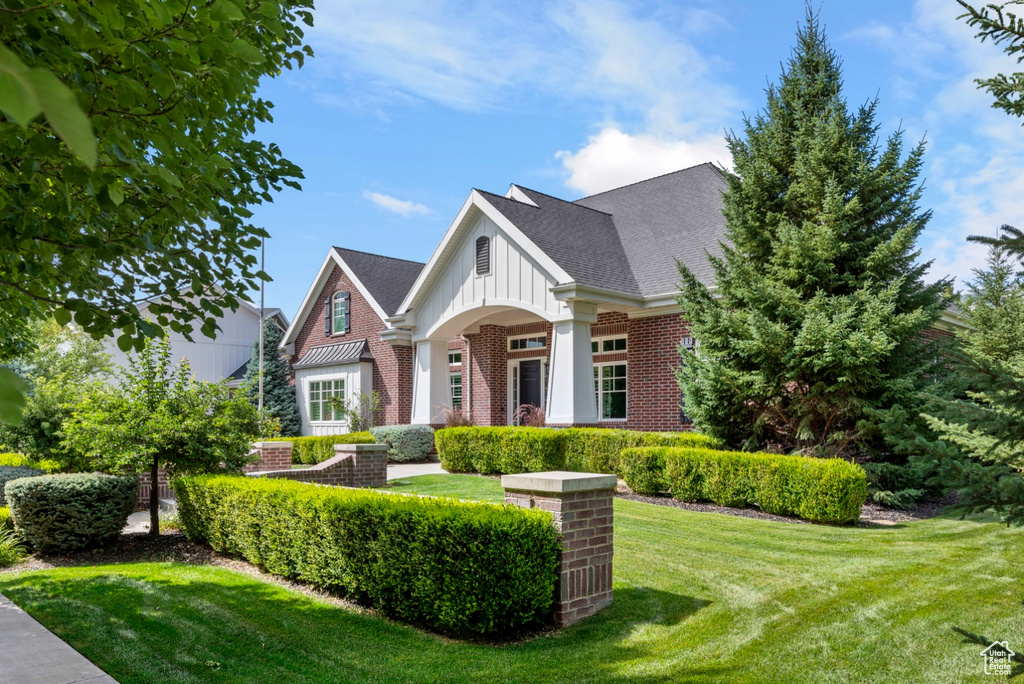 View of front of property with a front lawn