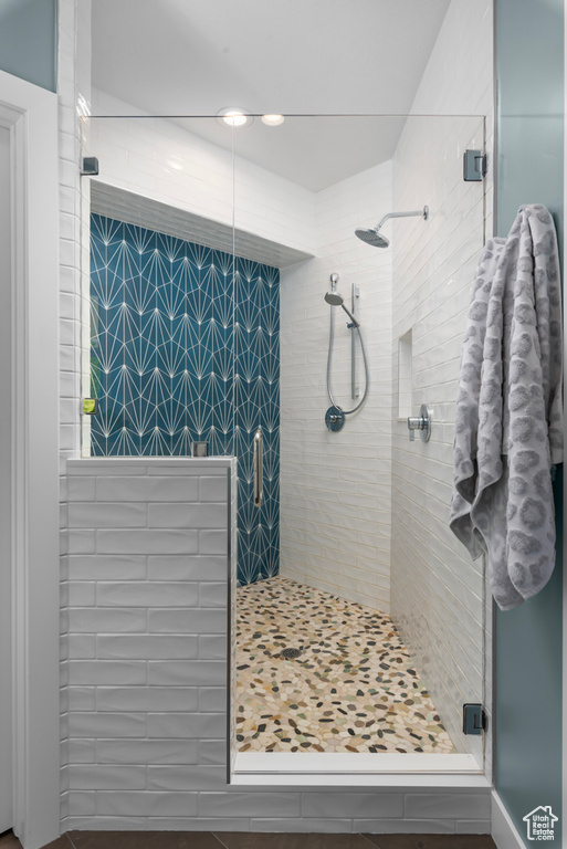 Bathroom featuring a shower with door