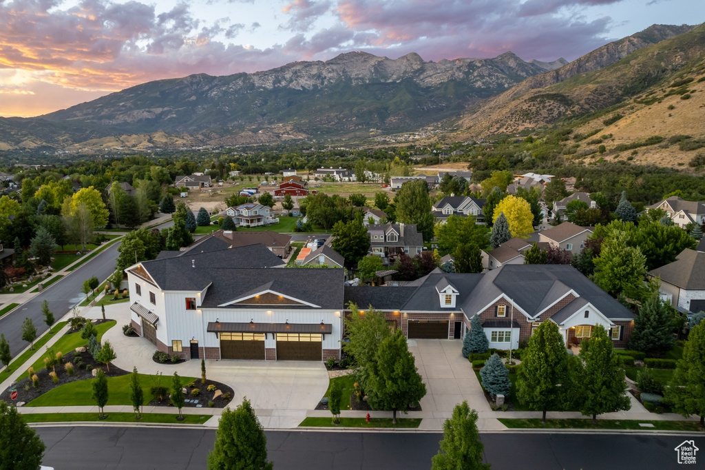 Aerial view at dusk featuring a mountain view