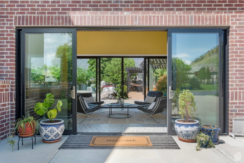 Entrance to property with a patio area