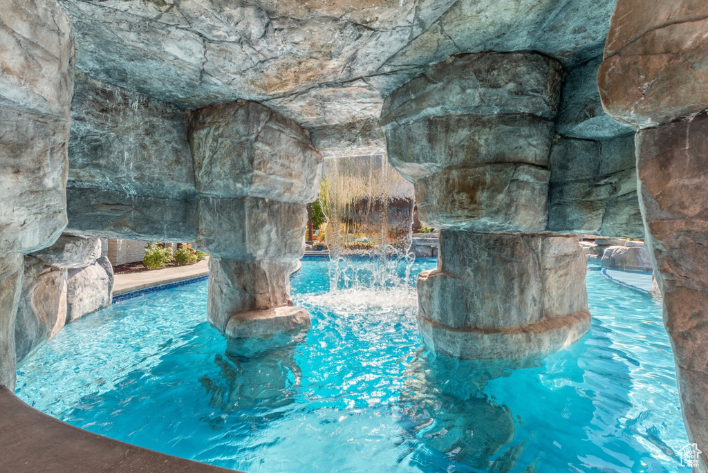 View of pool featuring pool water feature