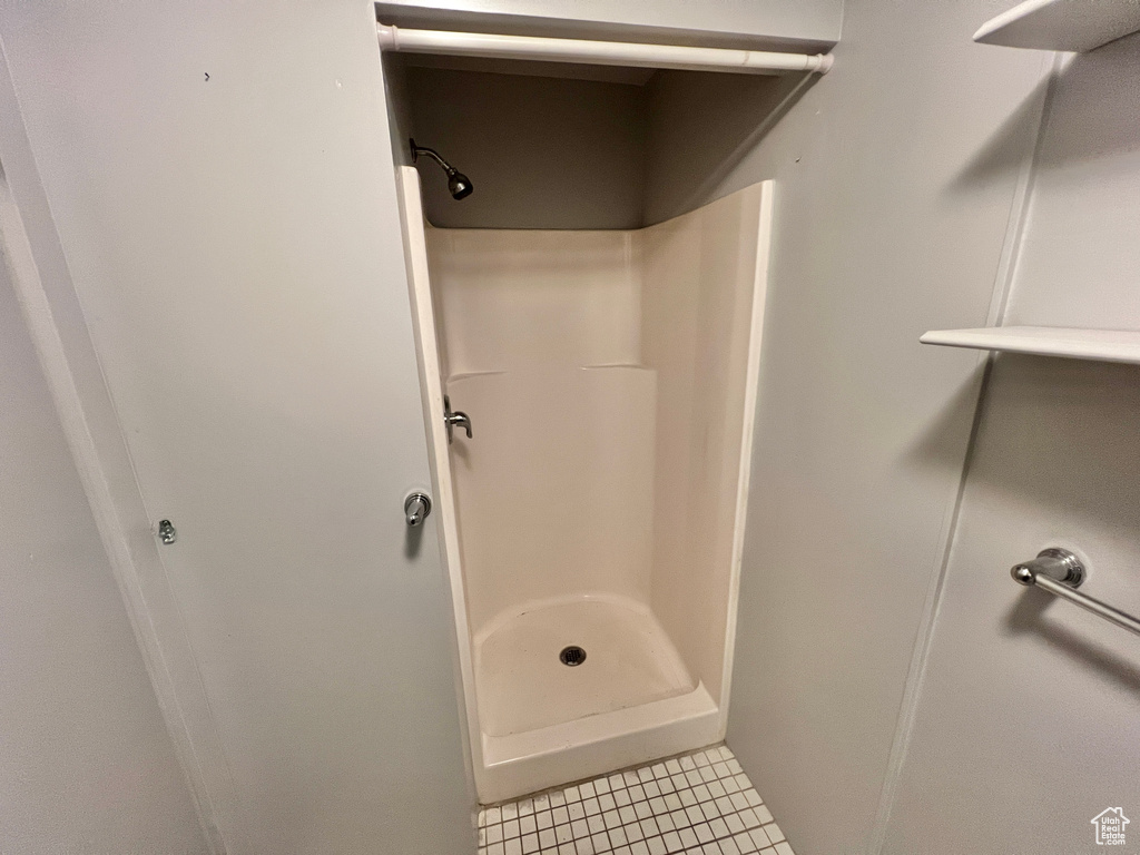 Bathroom featuring tile floors and walk in shower